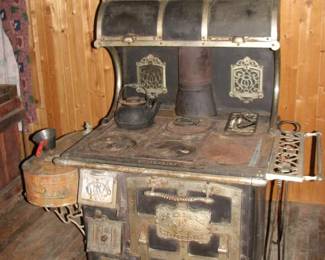 Wood fired cast iron cook stove (is in the house)