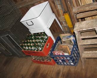 Wash tub, glass bottles , rabbit cages, truck mirrors, lots of license plates