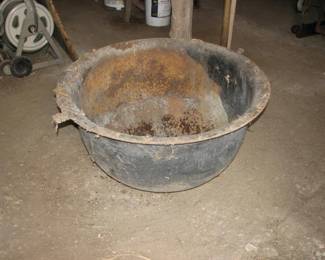 this is a large cast iron cauldron