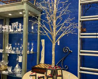 Vintage oval marble top iron wine table by Bella Toscano.                                                                                                                      LED lit gold glitter tree.  Mahogany chess box with brass feet and 2 drawers to hold pieces.