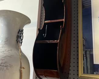 Unusual find half cello  wall shelf. Would fit cd’s on shelves. Beautiful lacquered wood