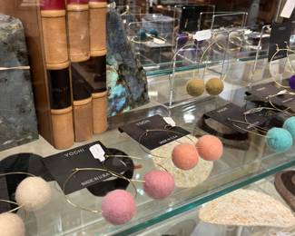 Polished Labradorite bookends.                               Lightweight 14k gold filled earring hoops with wool poms by Yochi NY. Lots of colors. 50% off