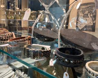 X Large mouth blown glass sand timers with black sand and Leatherrock cuffs