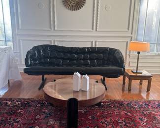 Vintage Modern Black Faux-Leather Tufted Sofa with Metal Base  (72"W x 29"D x 27" Back Height) & Round Lacquered Wood with Half Round Legs Coffee Table (32"D x 14"H)