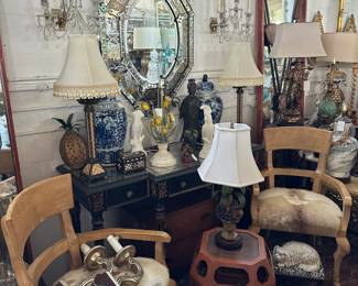 Pair of armchairs with hide-upholstery, Vintage side table, Neoclassical painted console, Venetian mirror, Irish glass and crystal sconces, and more.