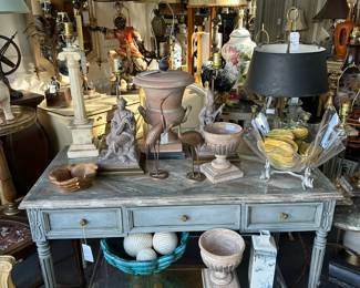 Louis XVI painted writing table, Bouillotte lamp, Arthur Court Lucite bowl, Alabaster column lamp, Brass chest side table, and more