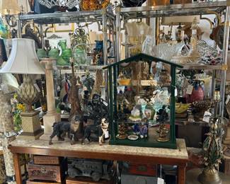 Narrow marble top console, Collection of boxes, Iron French bulldog doorstops, Tole artichoke lamp, Alabaster column lamp. 