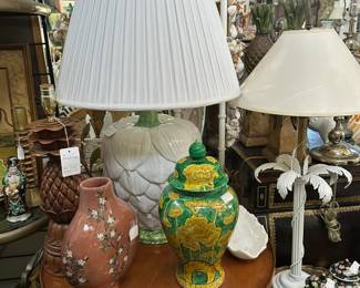 Large pottery artichoke lamp, Pair Famille-noir ginger jars, Painted metal palm tree lamp, Round satinwood end table, and more.