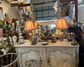 18th/19th C. French enfilade, Foliate-carved mirror, Tole bouillotte lamp, Pair of porcelain parrots, Mid-century modern pendant fixture.