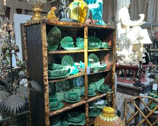 Burnt bamboo English bookcase, Collection of pottery cabbage ware, Vintage pottery lamp, Pair of bamboo fretwork armchairs, Large Kwan Yin statue.