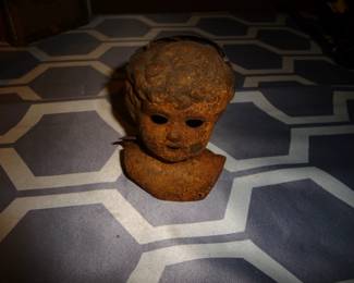 antique metal doll head