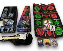 HUGE lot Of Vintage Play Station 2 PS2 Games And Accessories Including: A Harmonix 822151 Stratocaster Guitar Controller, A GE2000 First Act Guitar Controller, x2 Dance Dance Revolution DDR Konami Dance Mats, Rock Band Special Edition PS2 PlayStation Drums, x2 PS2 Controllers, And x10 PS2 Games
