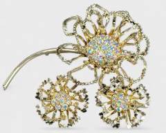 Vintage Sarah Coventry Gold Metal Flower Brooch and Clip on Earrings Set with Iridescent Rhinestones
