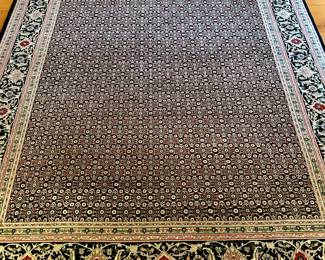 Hand woven Tabriz rug.
