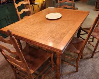 A great Dining Table with Pull Out Leafs and 6 Ladder Back Chairs with Rush Seats!