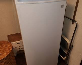 A slim Kenmore Freezer. 