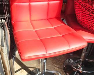 four chrome and vinyl bar stools