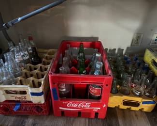 Coca Cola bottles and plastic crates