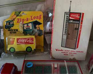 Coca Cola toys and a new in box vintage transistor radio