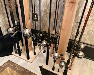 over 32 rod and reels + handmade rod stands