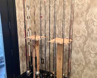 over 32 rod and reels + handmade rod stands