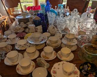 Wooden Dining Table, Waterford Crystal,Large Collection of Fine China Tea Cups, Glass/Crystal Bells, Milk Glass and much more.
