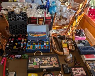 Match Box Cars, Black Powdered Pistol, Gold Pocket Watch, Campaign Pins, Digital Cameras, Betty Boop, and much more.