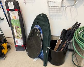 Umbrellas, sleds, Coleman umbrella
