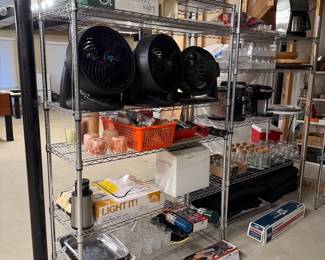 Shelves, fans, tin buckets, candles, glasses