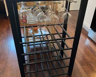 Metal wine rack with glass top