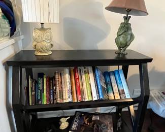 Table lamps, shelving unit, cookbooks and books