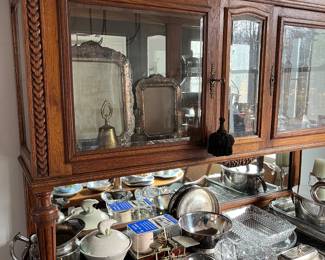 Closer look at the top of the antique hand-carved hutch/buffet with marble top.