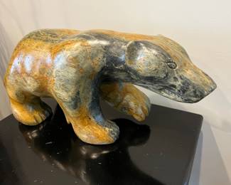 Large Inuit hand-carved stone near sculpture by Jonasie Fabre.