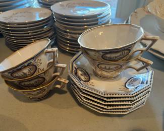 Set of Nyphenburg porcelain saucers (6) and teacups (5).