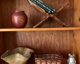 Pottery by Grand Rapids artist Scott Berman; vintage hand-carved wood collapsible book rack.