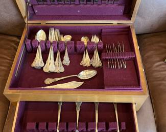 77-piece sterling flatware set, including seven serving pieces.