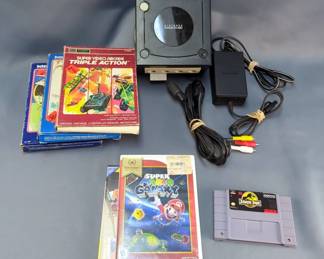 Nintendo Game Cube With Games Including Mario Power Tennis, Naruto Clash Of Ninja 2, SNES Jurassic Park, Wii Super Mario Galaxy, Intellivision Star Strike And Skiing And Telle Games Super Video Arcade Triple Action