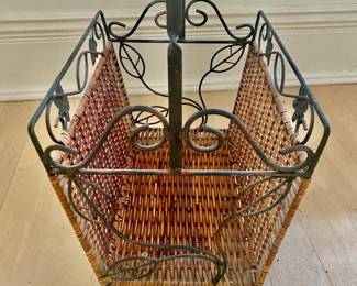 ANTIQUE WICKER MAGAZINE STAND WITH IRON LEAF TRIM AND HANDLE
