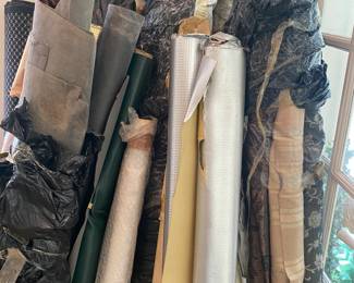 ASSORTED ROLLS OF FABRICS, AND LEATHER EMBOSSED FABRICATIONS