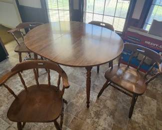 Kitchen table with 4 chairs, appears to look like maple wood