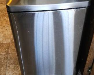 Stainless steel foot controlled opening trash can