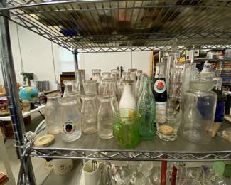Many milk bottles and pop bottles 