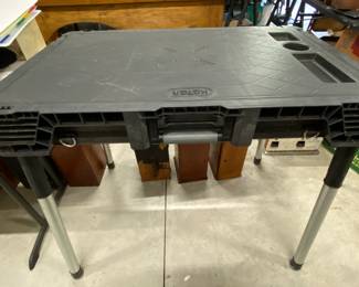 Keter portable table.  The legs screw off and store in the bottom of the table for easy storage and carry ability 