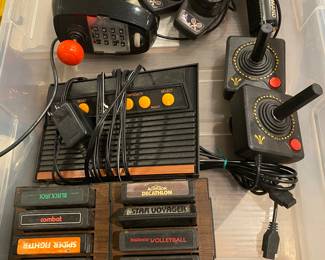 Atari game console and game pieces and a lot of games!
