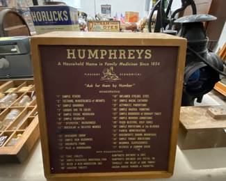 Humphreys advertising showcase with cabinet in the back