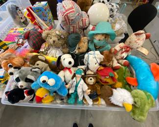 Stuffed animals to include again the Budweiser dog missing one ear and a teddy Rudskin