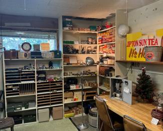 Rock hounding equipment, antique radios , tools old binocular microscopes, 1970s wood Formica table and chairs, antique clocks 