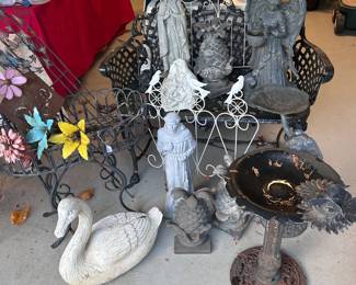 Outdoor yard decor. Wrought iron bench, planter, bird bath, statues, and more