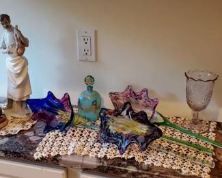 Lladro's and art glass flowers, antique perfume bottle