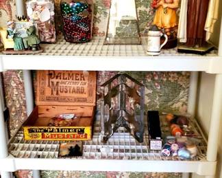 Old apothecary jars filled with shells & vintage Christmas beads. Vintage St Thersa statue, Anri carved wood girl figure, Candy mold (Cross Shape) Advertising box and more.